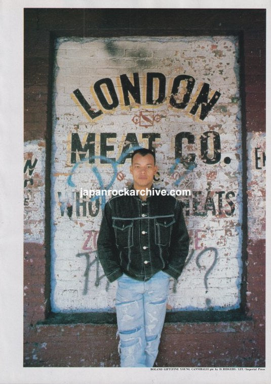 Fine Young Cannibals Roland Gift November 1989 Japanese magazine color pinup, standing before a painted London Meat Co. sign