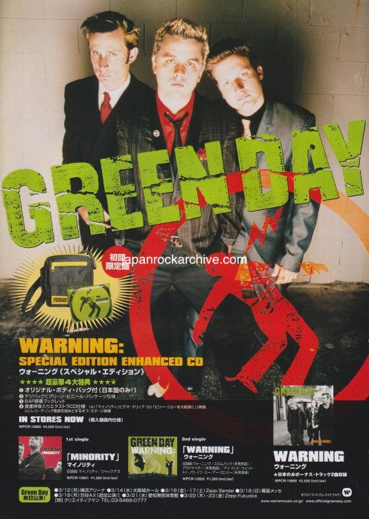 Promotional magazine ad for Green Day featuring three band members and text about their album 'Warning'.